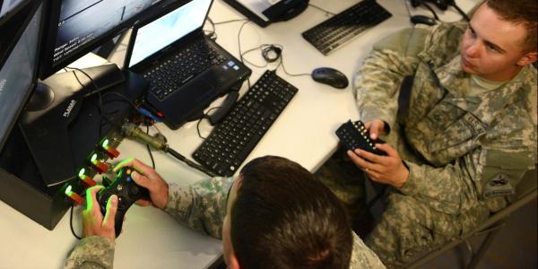 U.S. Army cyber warriors defend the network at the tactical operations center for the 2nd Armored Brigade Combat Team, 1st Armored Division, during a Network Integration Evaluation in fall 2015.