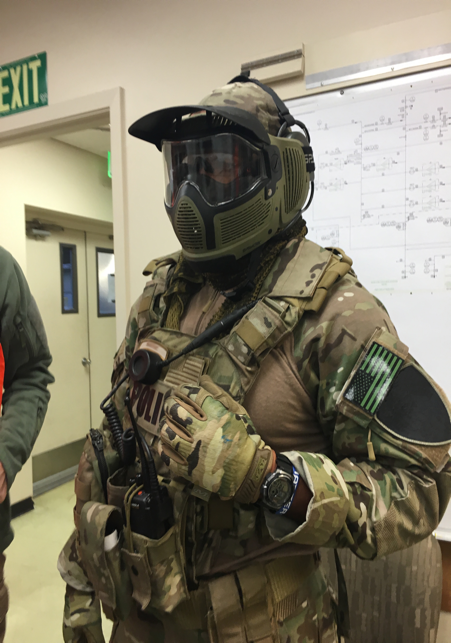 A fully equipped police SWAT team member wears Intel’s Recon Jet eyewear. Live video from Recon Jet’s camera can be shared with a command post or other team members.