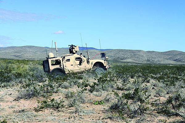 Soldiers from 2nd Brigade, 1st Armored Division drive a vehicle equipped with Warfighter Information Network-Tactical (WIN-T) Increment 2 during NIE 13.1 in November 2012. WIN-T Increment 2 is a major upgrade to the tactical network backbone that enables mobile mission command and extends the network to the company level for maneuver brigades.