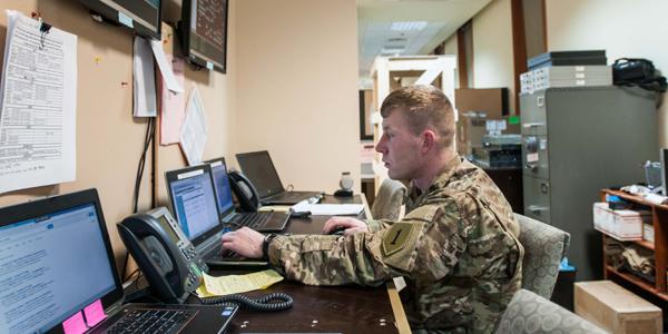 A network operations battle noncommissioned officer with the DHHB, 1st Infantry Division, monitors the CJFLCC-I network near the command’s operations center in Iraq. The network employs both Iraqi and U.S. communications capabilities to link diverse forces, along with surveillance and reconnaissance assets, over the country’s rugged terrain.