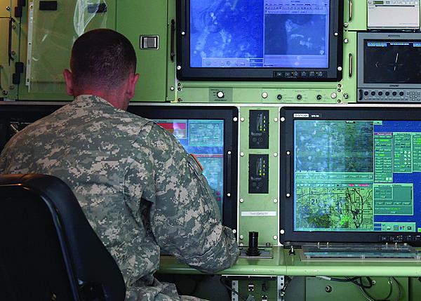 An unmanned aerial vehicle (UAV) operator monitors RQ-7 Shadow UAV operations during an exercise. Defense researchers are developing new control software to defeat an increasing threat of cyber attack on unmanned systems.