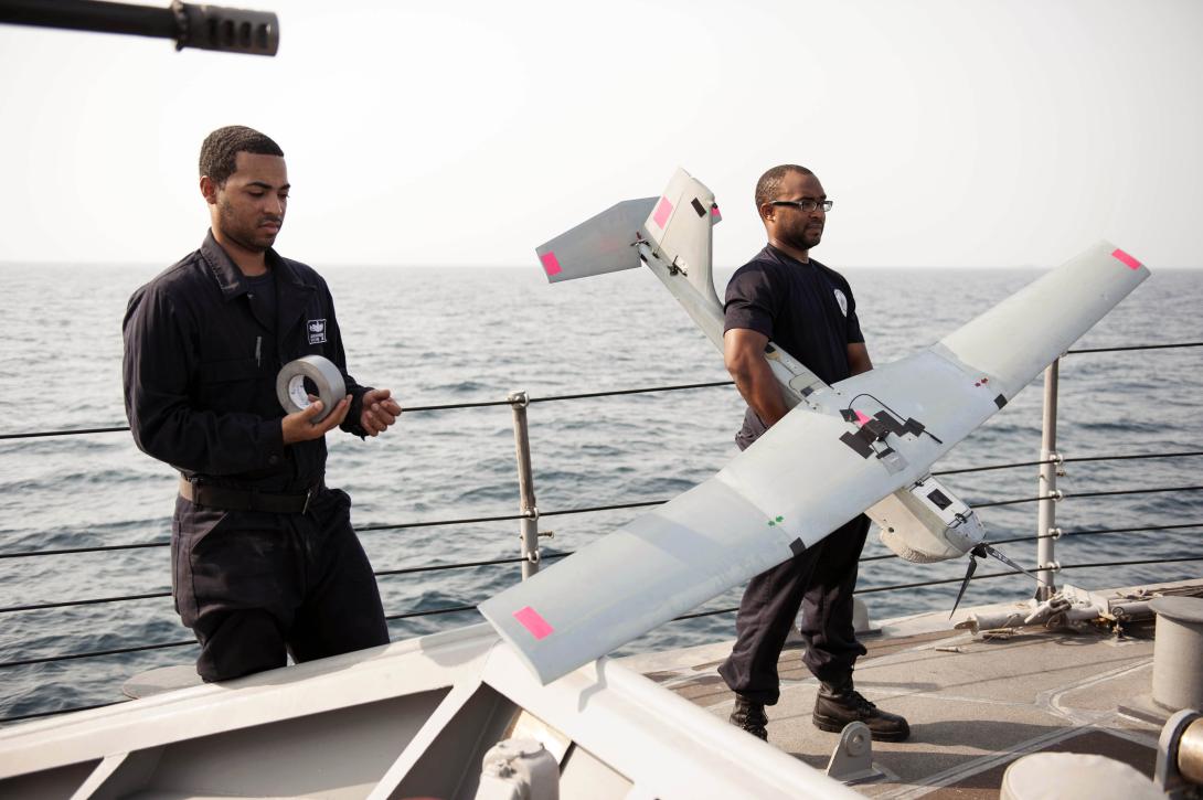 U.S. sailors conduct preflight checks on a Puma unmanned aerial vehicle (UAV) aboard the patrol coastal ship USS Monsoon. The Monsoon is one of 10 patrol coastal ships in Bahrain in support of maritime security operations. Photo by Petty Officer 2nd Class Ryan D. McLearnon, USN