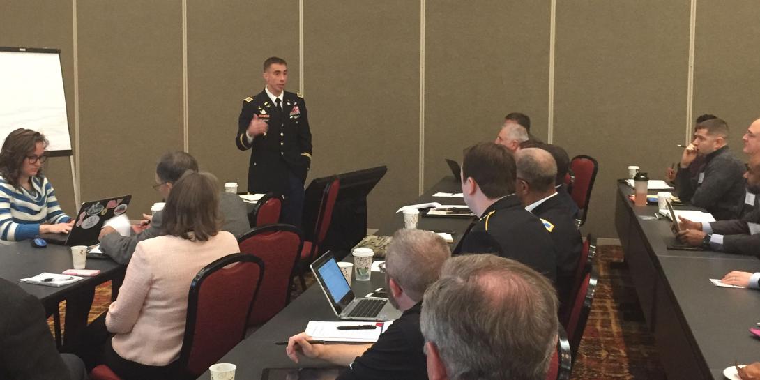 ol. Paul Stanton, USA, commander, Cyber Protection Brigade, leads his subgroup during a workshop on research and development supporting the cyber training environment and tools at the Cyber Education, Research and Training Symposium.
