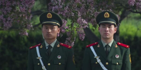 People’s Liberation Army (PLA) personnel stand in front of the Great Hall of the People in Beijing. Long-standing traditions, beliefs and doctrine underpin many PLA activities in cyberspace.