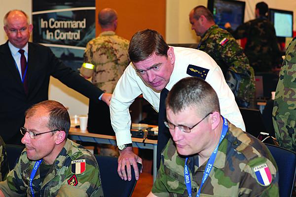  Gen. Stephane Abrial, FRA, Supreme Allied Commander Transformation (ACT), observes part of the Coalition Warrior Interoperability Exercise (CWIX) 12 held in June. The exercise helped validate the effectiveness of the new Tactical Edge Data Solutions (TEDS) joint capability technology demonstration (JCTD).