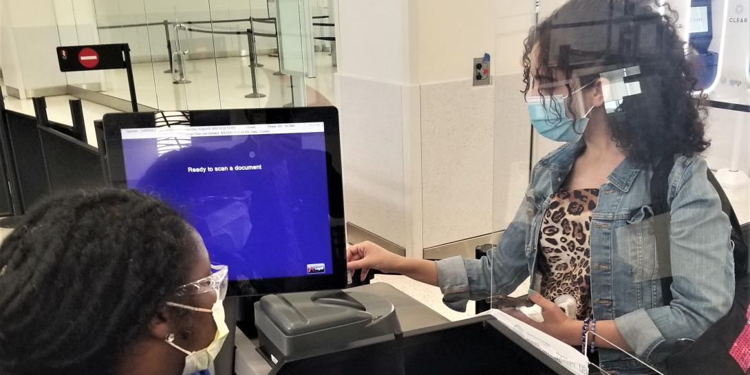 A traveler inserts her driver’s license into a new credential authentication technology unit at BWI Airport. In response to COVID-19, the TSA has purchased and continues to contract for innovative technologies that protect its personnel and data as well as travelers. Credit: Photo courtesy of TSA