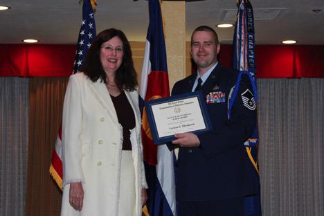 Dr. Merri Sanchez, chief science and technology adviser, Air Force Space Command, presents the AFCEA War Veterans Undergraduate Scholarship, Afghanistan and Iraq War Veterans, to Master Sgt. Vernon S. Thompson, USAF, at the Rocky Mountain Chapter’s May awards banquet.