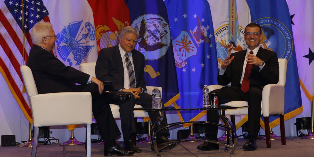 From l-r, Robert K. Ackerman, SIGNAL editor in chief, moderates a TechNet Cyber luncheon plenary with speakers Tony Montemarano, DISA executive deputy director, and Jeffrey Jones, executive director, JFHQ-DODIN. Photo by Michael Carpenter