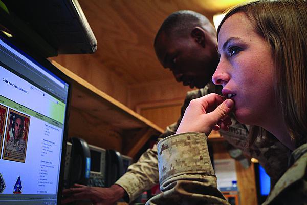 A U.S. Marine Corps lance corporal data network specialist works at a help desk in the headquarters element of Task Force Leatherneck, 1st Marine Division (Forward). The Corps has completed a transition to its part of the Next-Generation Enterprise Network (NGEN), and a key element of that transition was empowering Marines to provide full end-user support across their network.