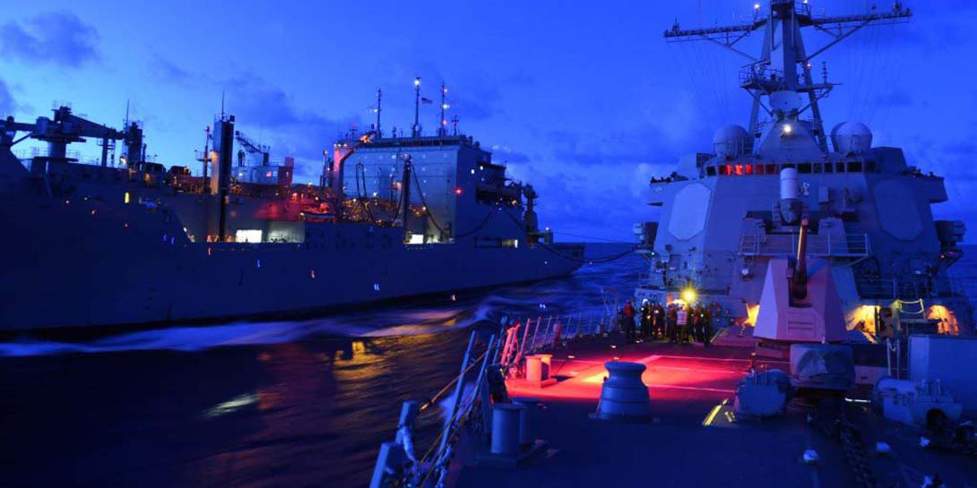 A U.S. Arleigh Burke-class guided missile destroyer refuels and resupplies in the South China Sea. The U.S. Pacific Command (PACOM) is expanding its roles and relationships in the Asia-Pacific region amid new and growing threats.