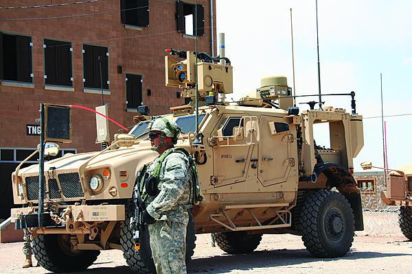 A soldier stands next to a WIN–T Increment 2 point of presence vehicle during its initial operational test and evaluation concurrent with the Army’s Network Integration Evaluation (NIE) 12.2 at White Sands Missile Range, New Mexico. Ongoing NIE tests could help clear the way for a full-rate production decision for Increment 2 later this year.