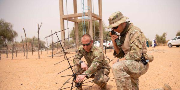 Army Staff Sgt. Andrew Kirchoff, left, and Staff Sgt. Roberto Carlos Ramirez operate a satellite communication antenna in Kaedi, Mauritania, February 2020, during Flintlock. The modern warfighter must remain light and agile and enjoy ease of communication, highlighting the necessity for and relevance of devices such as the Global Rapid Response Information Package.  Army Cpl. Kevin Payne