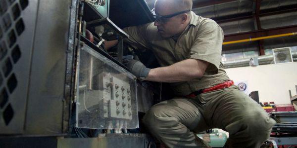 The Pentagon is working to develop small, modular nuclear reactors to replace gas-guzzling generators like this one. In 2013, Staff Sgt. Michael Bellanca, USAF, aerospace ground equipment craftsman, 376th Expeditionary Maintenance Squadron, had to maintain a diesel generator in the U.S. Transit Center at Manas, Kyrgyzstan.  U.S. Air Force photo/Staff Sgt. Robert Barnett