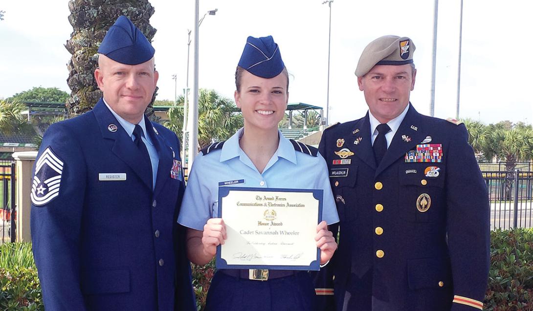 AFCEA’s Tampa-St. Petersburg Pelican Chapter President, Col. John McLaughlin, USA (r), and Chief Master Sgt. Robert Register, USAF, present Cadet Savannah Wheeler with the AFCEA ROTC Honor Award. She is a junior majoring in computer science at the University of South Florida. The award recognizes achievement in leadership and academics by ROTC cadets and midshipmen. Recipients are required to be in their junior year and are selected by professors of military science, naval science or aerospace studies.