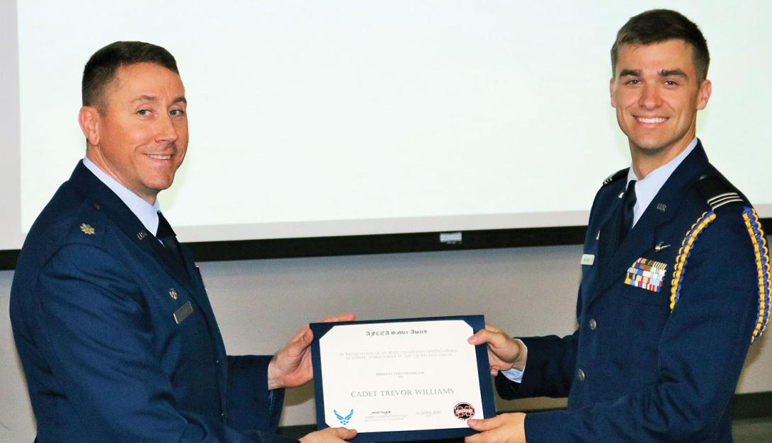 The Maj. Gen. Robert E. Sadler, USAF, Honor Award is presented to Cadet Trevor H. Williams (r) in April at Mississippi State University.