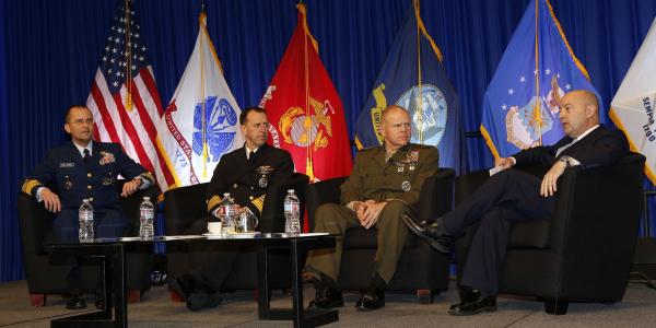 Key sea service leaders comparing perspectives in a town hall format are (l-r) Vice Adm. Charles D. Michel, USCG, vice commandant, U.S. Coast Guard; Adm. John M. Richardson, USN, CNO; Gen. Robert B. Neller, USMC, commandant, U.S. Marine Corps; and moderator Adm. James Stavridis, USN (Ret.), dean, The Fletcher School of Law and Diplomacy.