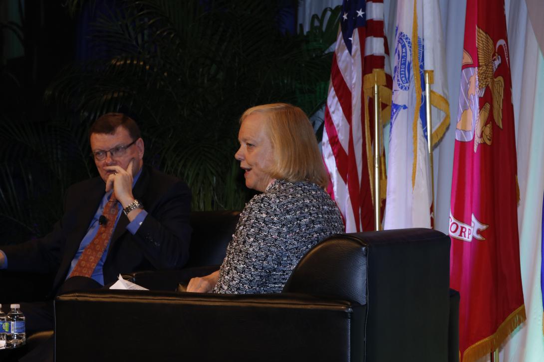 Meg Whitman (r), president and CEO, Hewlett Packard Enterprise, gives an industry perspective as Terry Halvorsen, U.S. Defense Department CIO, listens.