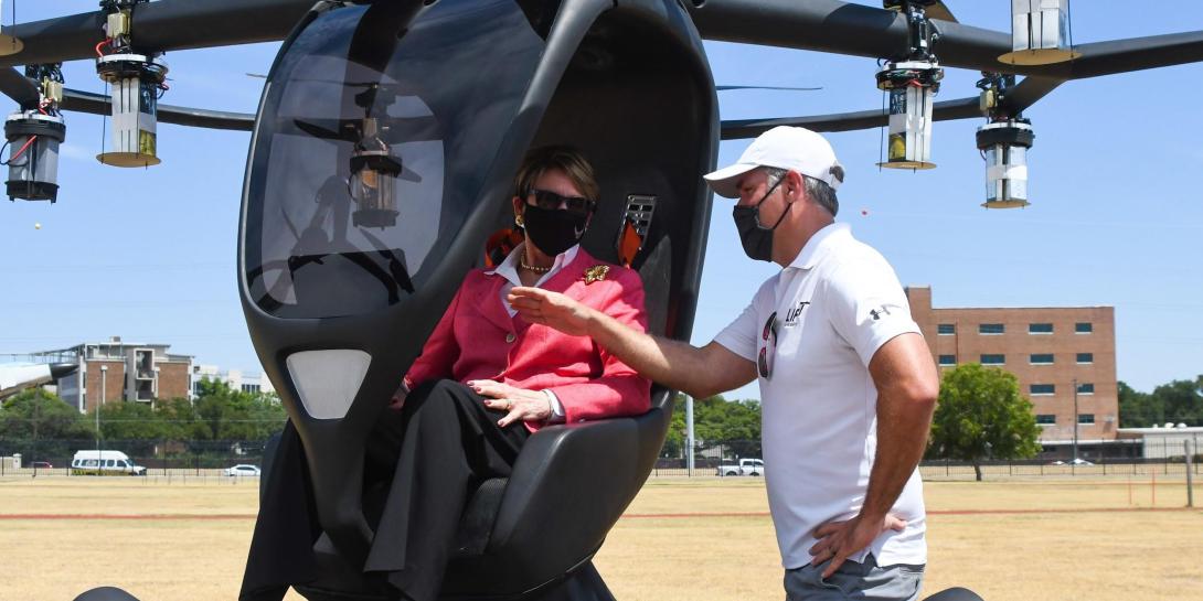 LIFT Aircraft CEO Matthew Chasen shows Secretary of the Air Force Barbara Barrett the controls of the company's Hexa electric vertical takeoff and landing (eVTOL) aircraft at Camp Mabry, Texas, on August 20. The demonstration, hosted by the Texas Air National Guard, was the first in a series that the service's Agility Prime will hold this fall as it strives to field eVTOL aircraft by 2023. Credit: Air National Guard photo by Staff. Sgt. Sean Kornegay