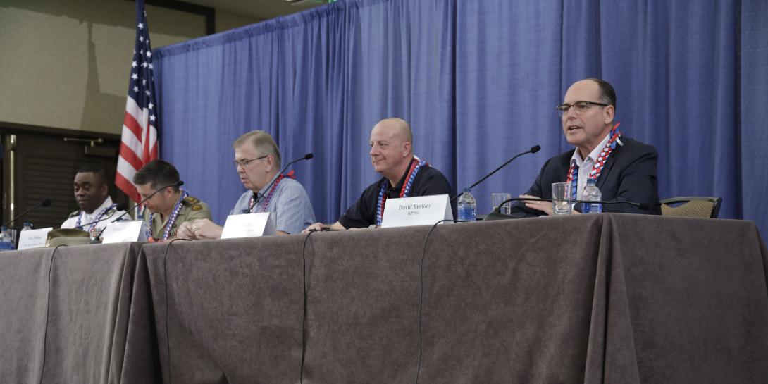 Officials from four nations address issues confronting efforts to achieve coalition interoperability. Credit: Bob Goodwin Photography