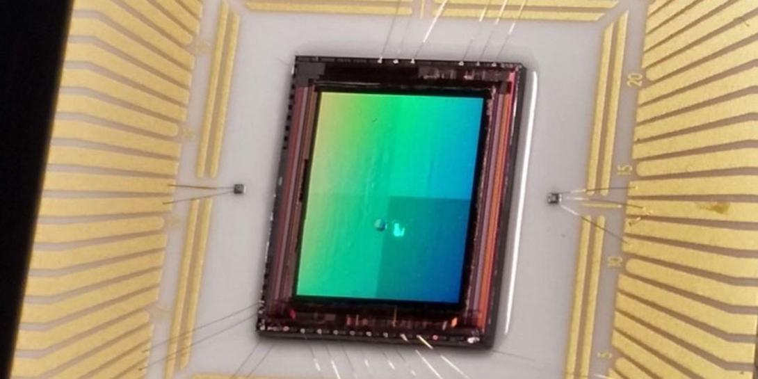 Sandia National Laboratories researchers are ready to commercialize a nanoantenna-enabled detector on an assembled focal plane array for a thermal infrared camera. The gold nanoantennas are too small to be visible on top of the detector array.    Photo courtesy of Sandia National Laboratories 