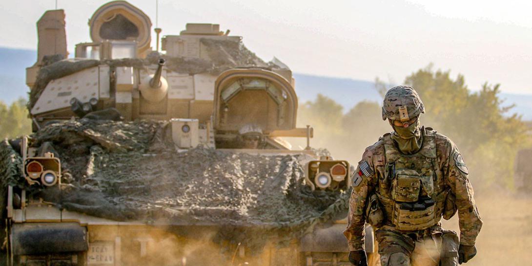 A soldier guides an M2A3 Bradley Fighting Vehicle during an exercise at Novo Selo Training Area, Bulgaria, in August 2018. On December 18, 2020, Army officials released a request for proposals for the Optionally Manned Fighting Vehicle.   Credit: U.S. Army photo