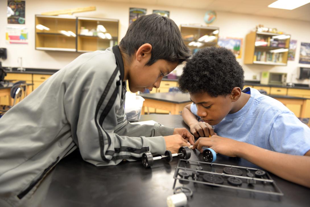 McKinley Middle School students design and build the model car they will race in the New Mexico Electric Car Challenge on November 22 at Albuquerque’s Highland High School.
