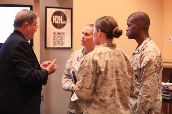 Marines speak with a potential employer a Hiring Our Heroes Veterans Event hosted by the U.S. Chamber of Commerce at the Pacific Views South Mesa Club at Camp Pendleton, Calif. in September 2012.