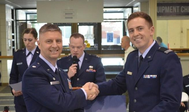 Cadet Eric C. Mielke, Air Force ROTC, Utah State University (r), receives an ROTC Honor Award from Lt. Col. Steven Smith, USAF, director of the university’s Air Force ROTC program.