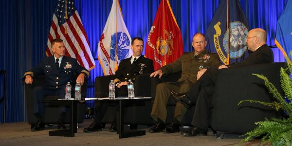 From l to r, service chiefs from the U.S. Coast Guard, Navy and Marine Corps address critical issues facing the U.S. military. Photo by Mike Carpenter