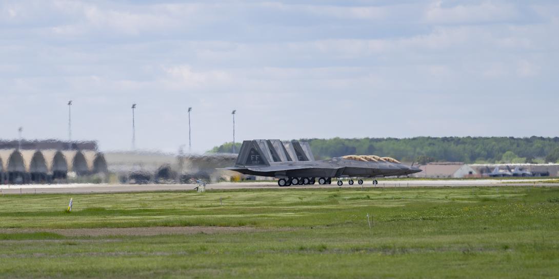 Four U.S. Air Force F-22 Raptors from the 1rst Fighter Wing line up before takeoff to conduct an adversary training sortie at Joint Base Langley-Eustis, Virginia on April 10. The Air Combat Command, which is responsible for the service's cyber mission, is examining the Air Force's cyber stance closely during the COVID-19 pandemic. Credit: U.S. Air Force photo by Nicholas De La Pena