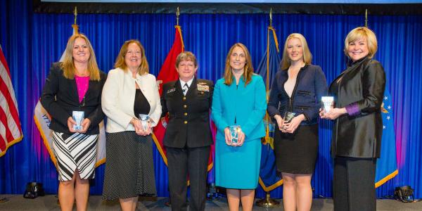 At the recent Women’s Appreciation Event during the West Conference in San Diego, keynote presenter Rear Adm. Danelle Barrett, USN, Navy Cyber Security Division director (c), congratulates Women’s Appreciation Award winners (from l) Tamara Greenspan, Kathleen Berganski, Ashley Becker, chair of Women in AFCEA, Abigail Wilson and Sharon O’Malley Burg.