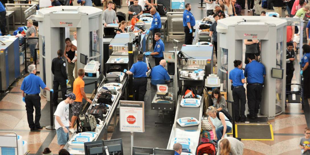 Travelers in long lines at Denver International Airport pass through Transportation Security Administration screening areas. Artificial intelligence software developed under an Intelligence Advanced Research Projects Activity program could help identify certain human behaviors. Jim Lambert/Shutterstock