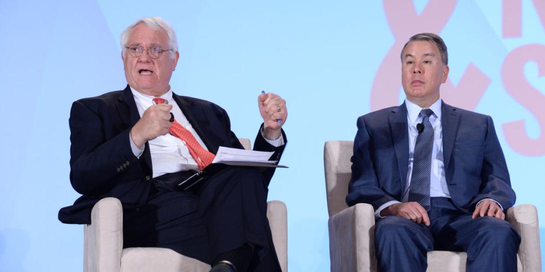 John Hamre (l), president of the Center for Strategic and International Studies, speaks with John Rood, undersecretary of defense for policy, during a panel discussion moderated by Hamre at the 2018 Intelligence and National Security Summit. Photography by Herman Farrer.